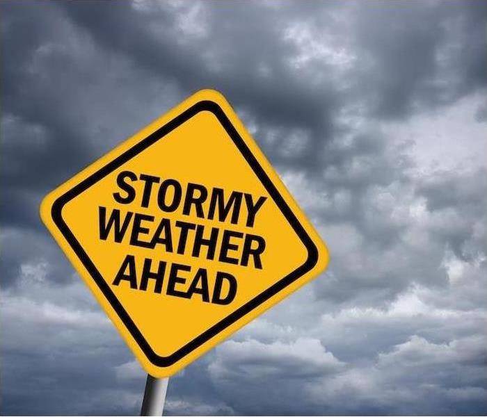 Sign saying "Stormy Weather Ahead."